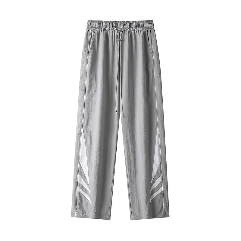 Men's straight-leg black casual sports trousers with a button fly and elastic mid-waist.
