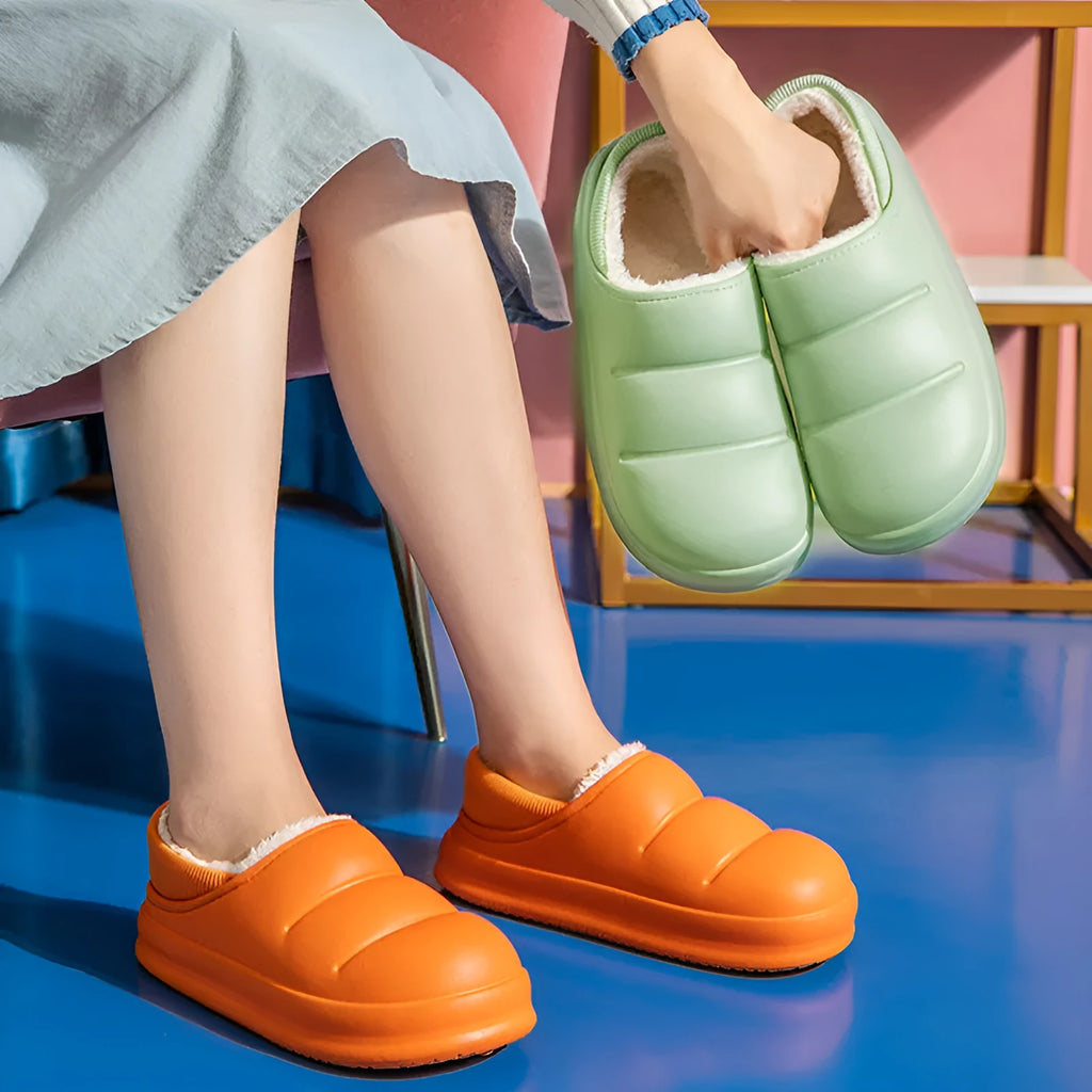 Yellow waterproof EVA garden slippers with a plush lining and textured non-slip sole.