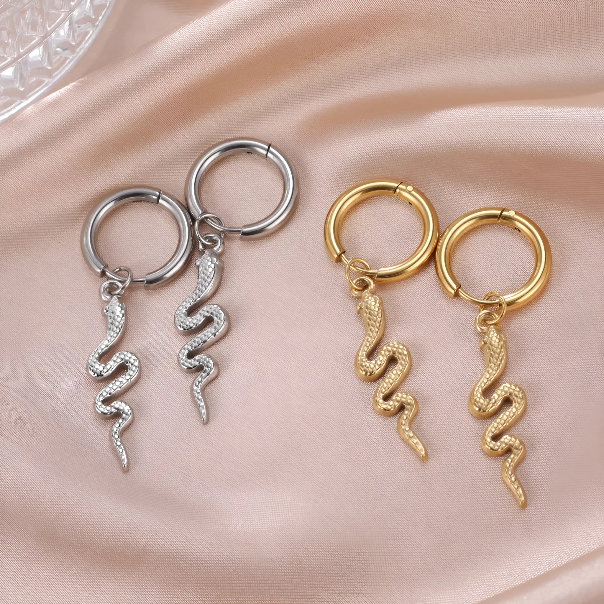 Stainless steel snake earrings with gold electroplating and vintage clip design