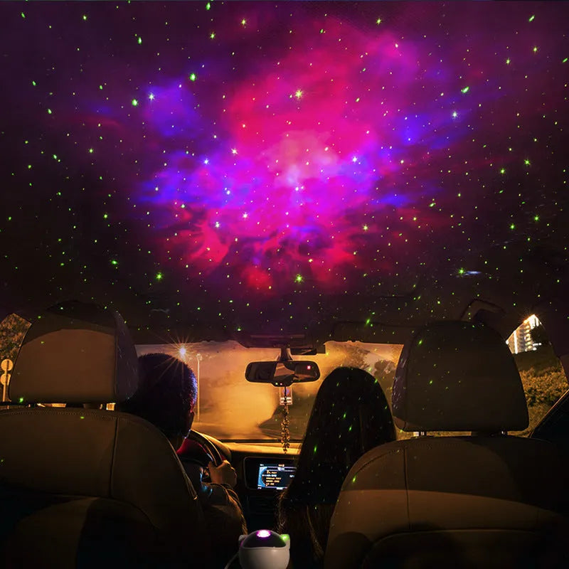 Creative astronaut galaxy starry sky projector nightlight on a table with nebula and star effects displayed against a dark background