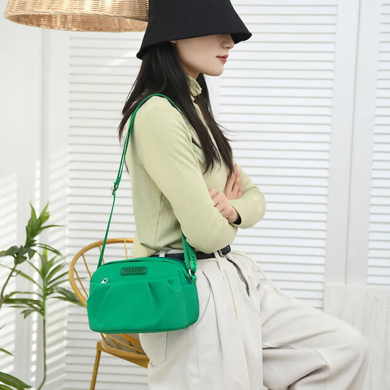 Pleated oxford cloth messenger phone bag with zip compartments in ten colour options