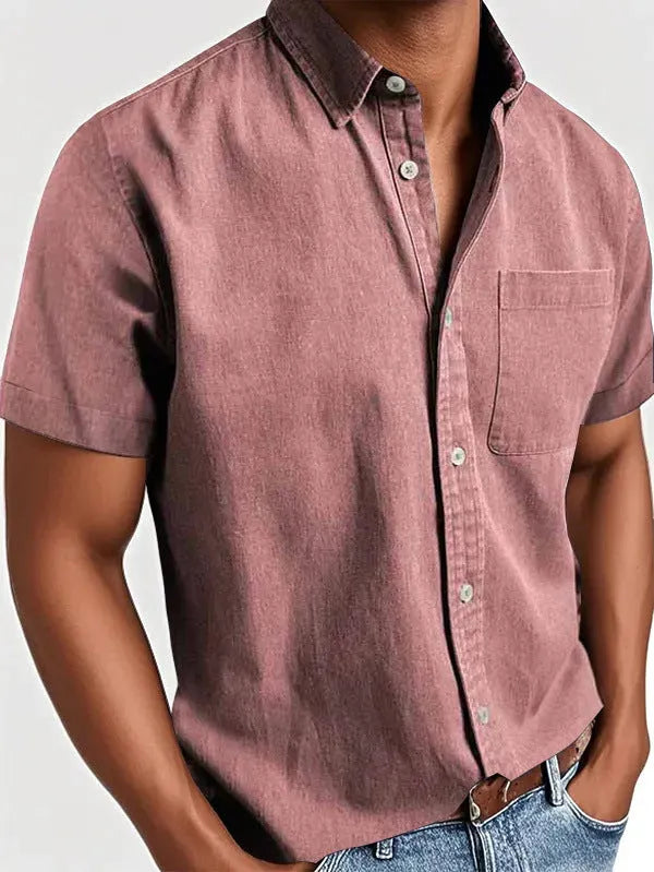 Men's solid colour short sleeve polo shirt with a chest pocket and polo collar on a hanger.
