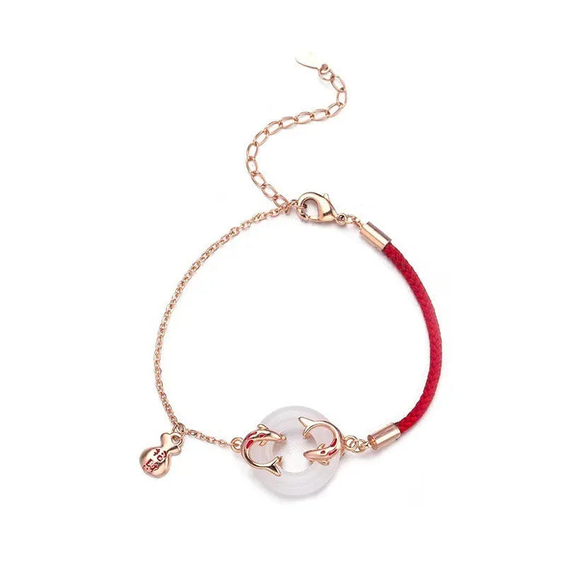 Festive koi bracelet with peace buckle fastening, adjustable red rope and fish tail decorative elements