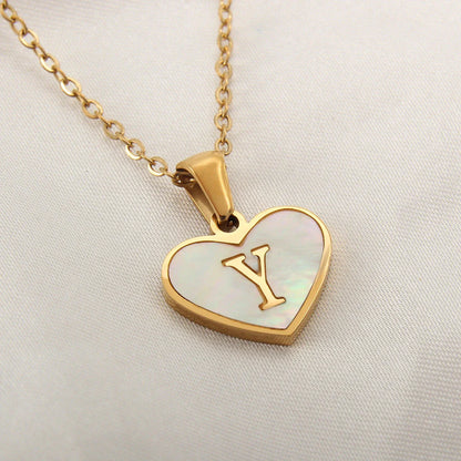 A personalized heart-shaped necklace with a 26-letter charm, crafted from high-quality stainless steel and gold plating.