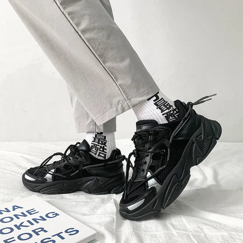 Men's white platform dad shoes with lace-up front and mesh lining on a neutral background.
