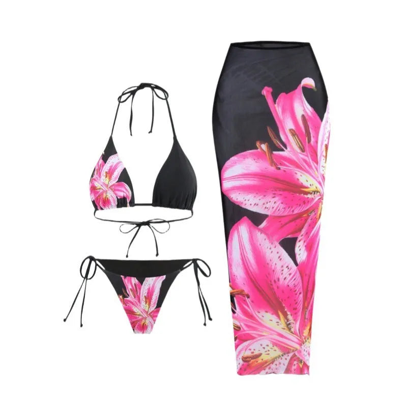 Women's printed bikini three-piece set with black red flowers and matching wrap skirt in polyester