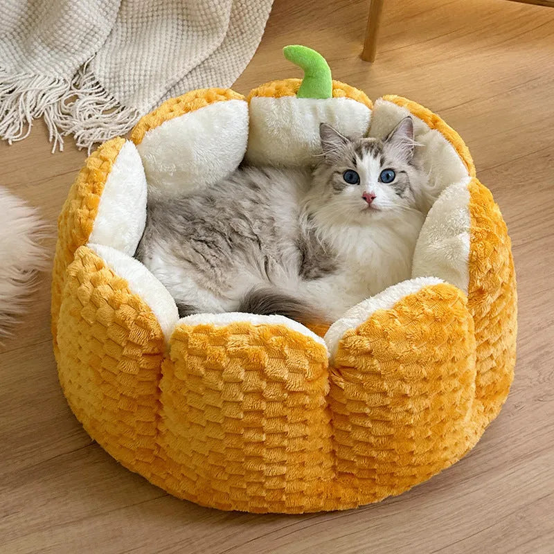 Pumpkin-shaped cat bed with raised rim showing interior cotton filling