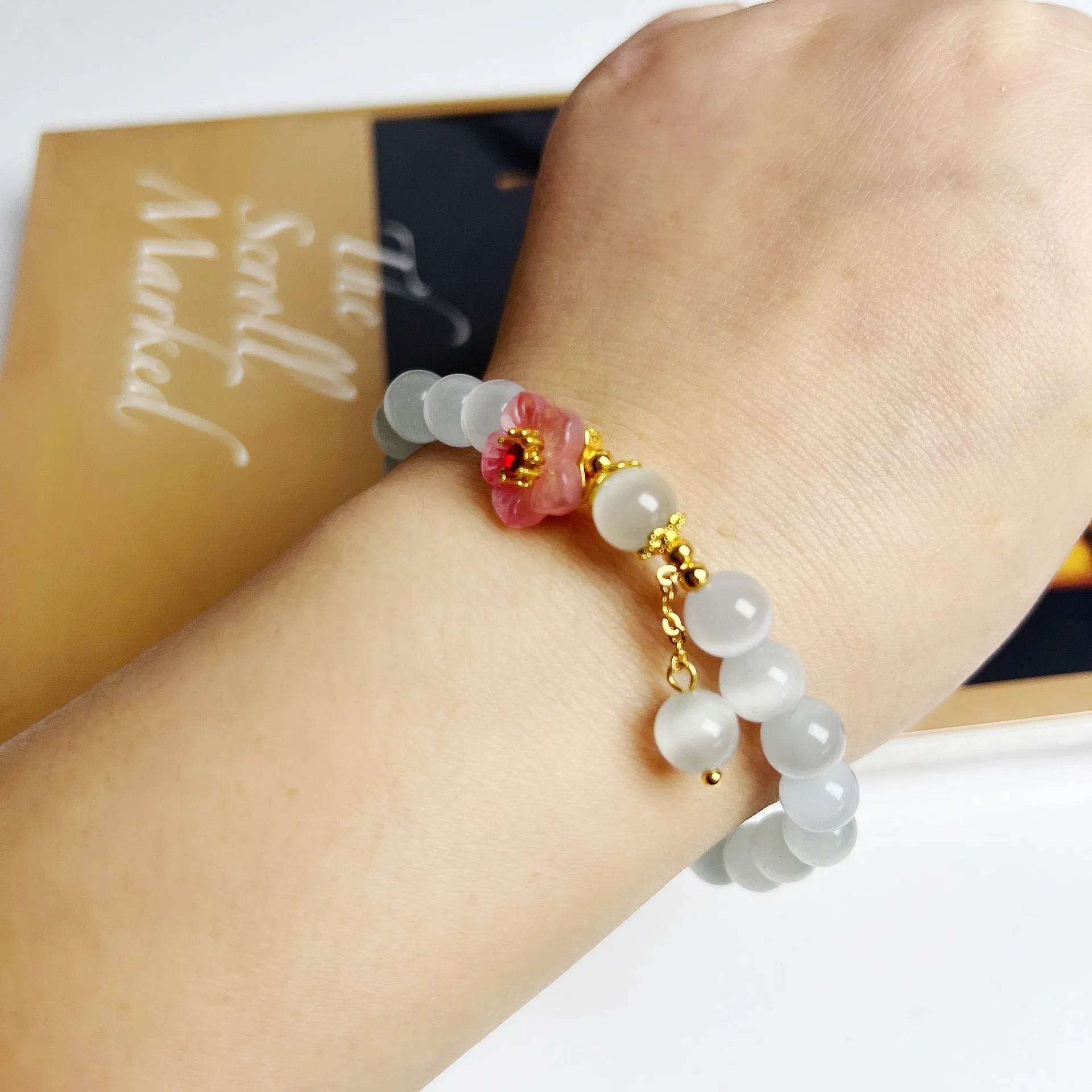 White opal flower beaded bracelet with Chinese style design using glass and coloured glaze materials