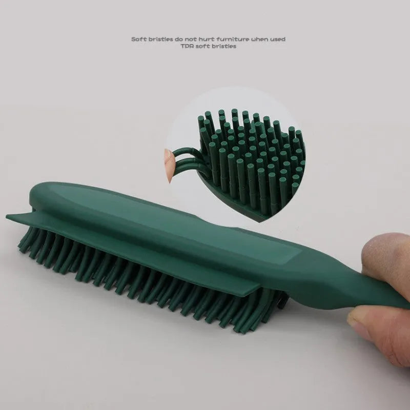 Green pet grooming brush with rubber handle and flexible bristles for removing hair from dogs, cats and clothing