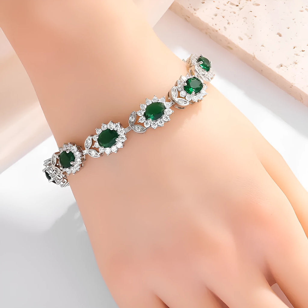 Simple electroplated alloy bracelet for women with inlaid zircon stone in one of nine colour options including ruby, emerald, and black onyx.