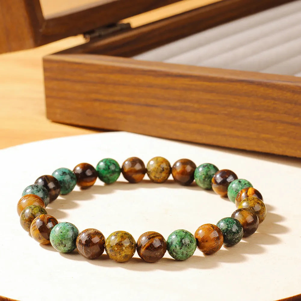 Tigereye stone bracelet with antique flower design measuring 18mm