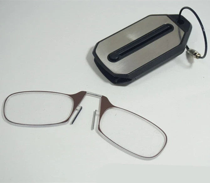 Compact magnetic reading glasses with rimless frames and adjustable nose clip