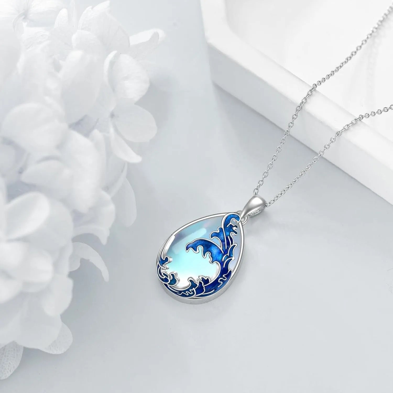 Moonstone blue heart pendant necklace with alloy chain on display
