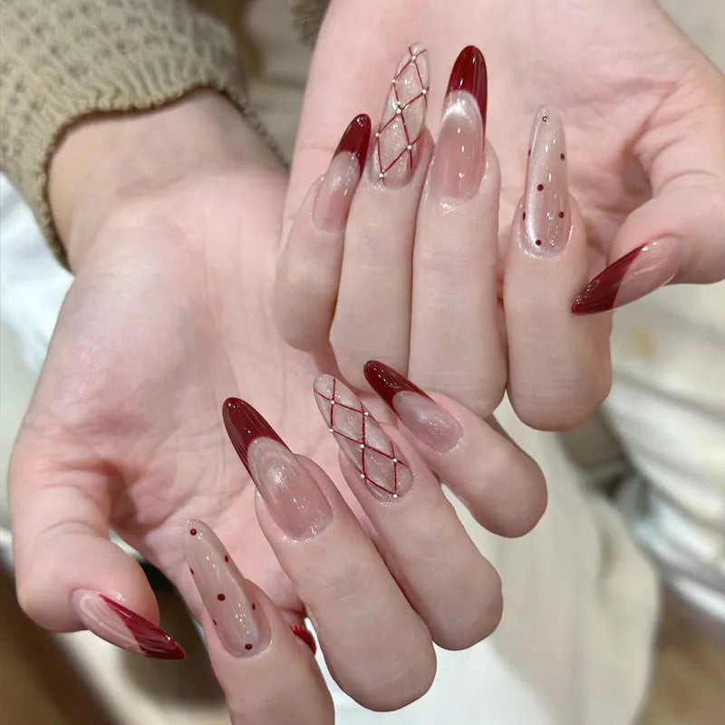 Medium length coffin-shaped fake nails in mixed colours with nail glue and application tools