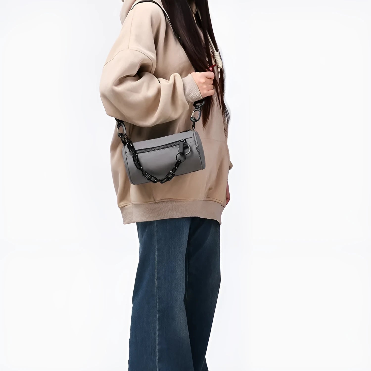 Black casual Oxford cloth messenger bag with a chain strap, shown closed.
