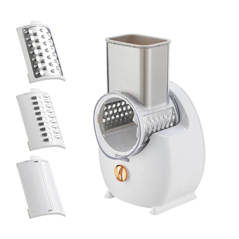 White electric vegetable slicer with rotary grater, feeding port, and multiple blade options on kitchen counter