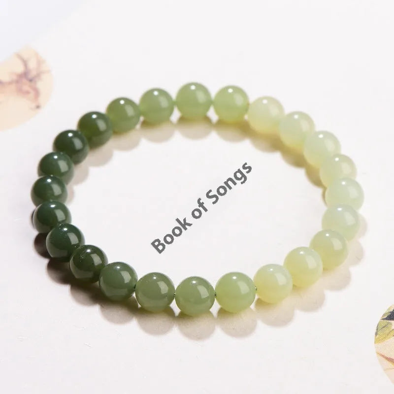 Natural clear water Hetian jade ball bracelet with round and barrel bead options.