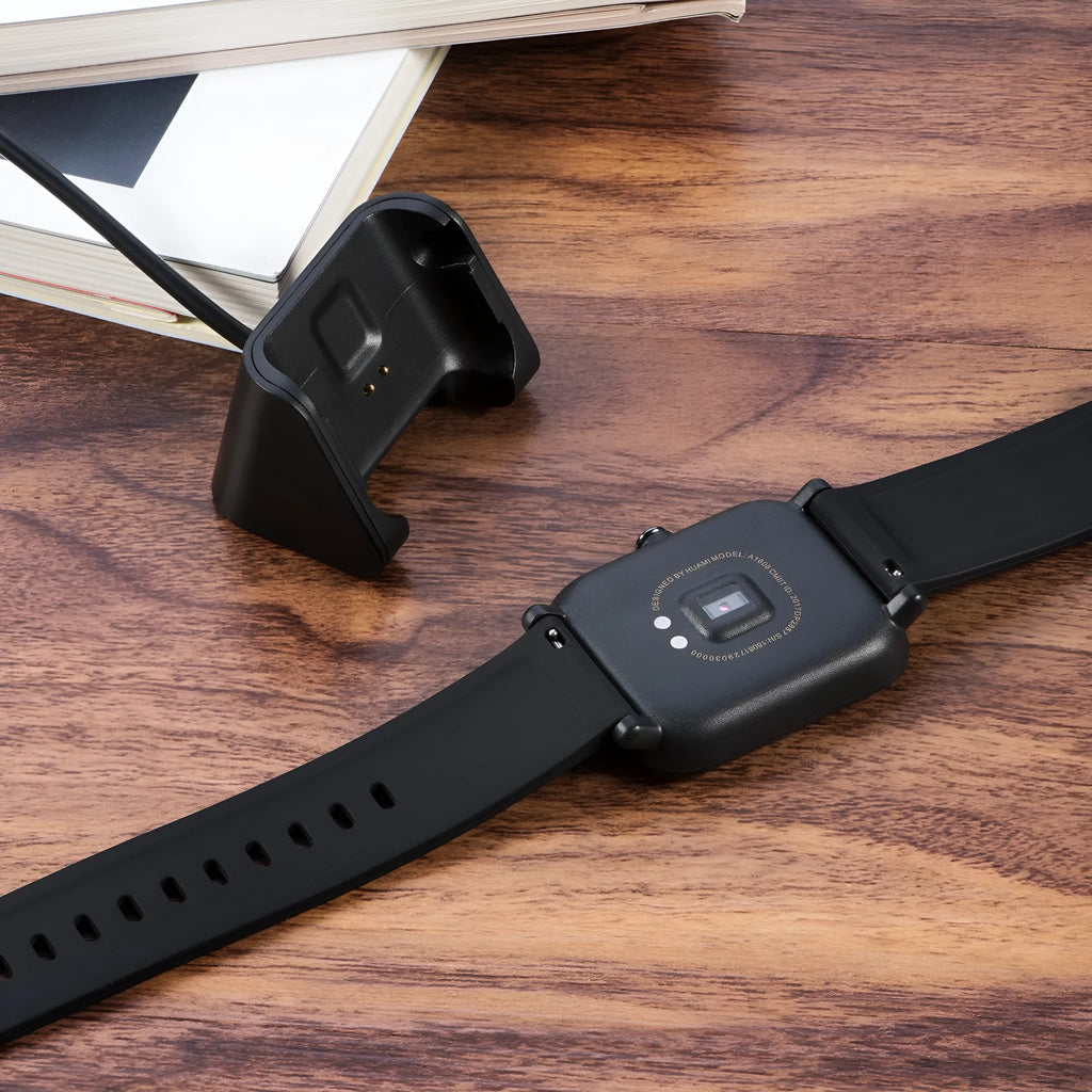 Black plastic charging cable for Youth Edition running smart watch, single replacement charger