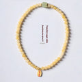 Women's hand-woven bracelet with topaz mantra barrel beads and square sugar jade beads