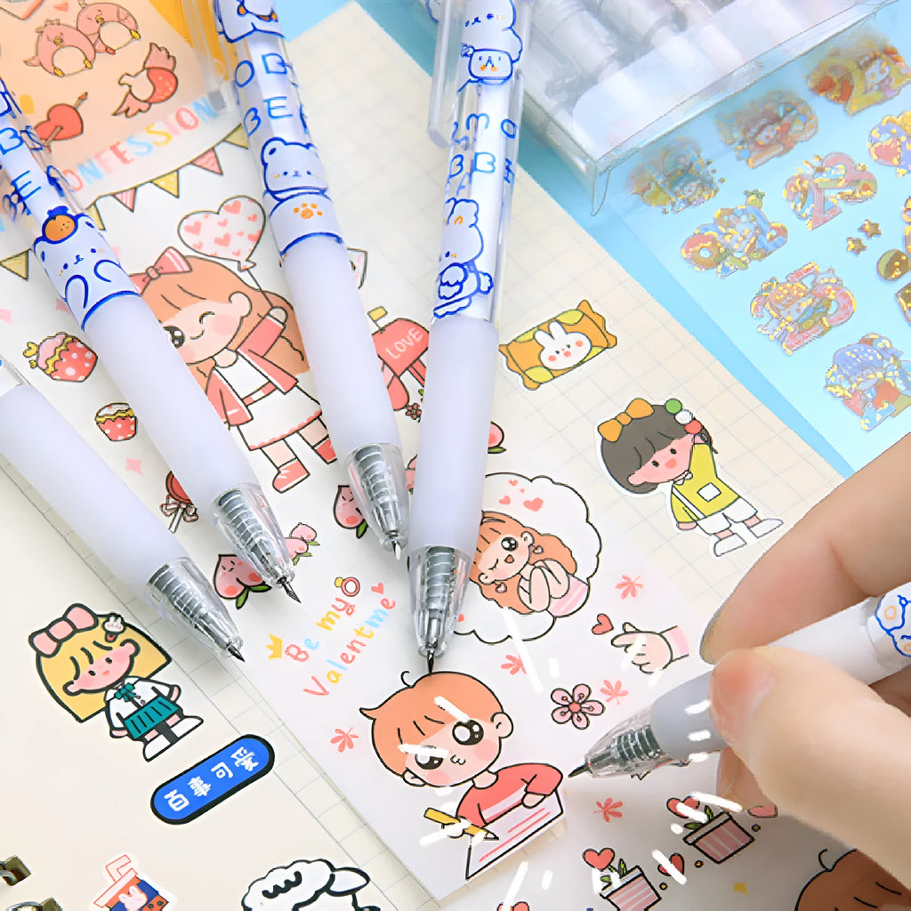 Six colourful press pen knives with bear and rabbit character toppers on a white background