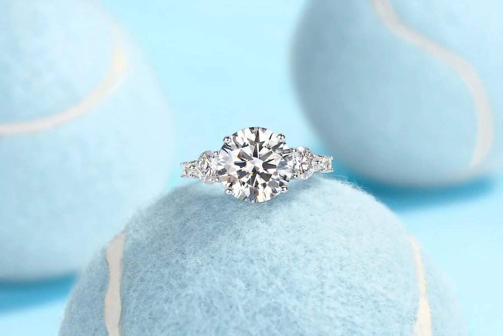 Three-diamond moissanite wedding ring with 5-carat stone, S925 silver band, platinum plating, on a white background