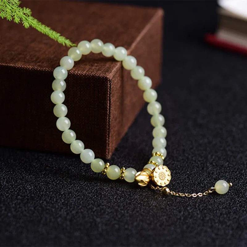 Natural Hetian jade bracelet with lotus carving and fu symbols on 6mm beads