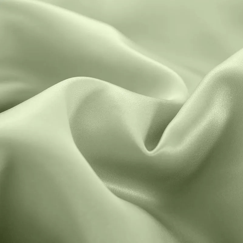 Silk duvet cover in a solid colour, shown in one of six colour options including Lotus Pink and Silver Blue.