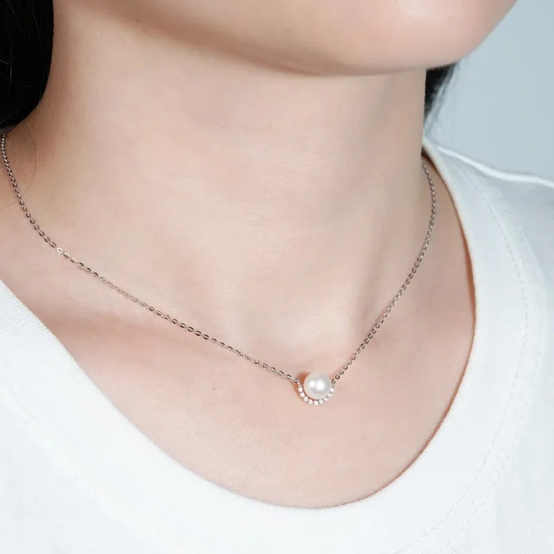 Women's 925 sterling silver geometric pendant necklace with pearl inlay and rhinestone accents, available in gold colour finish.