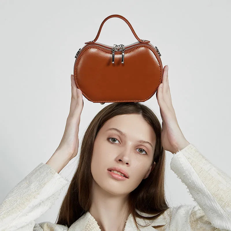 Creative fruit leather heart shape cowhide messenger bag in light brown with single shoulder strap