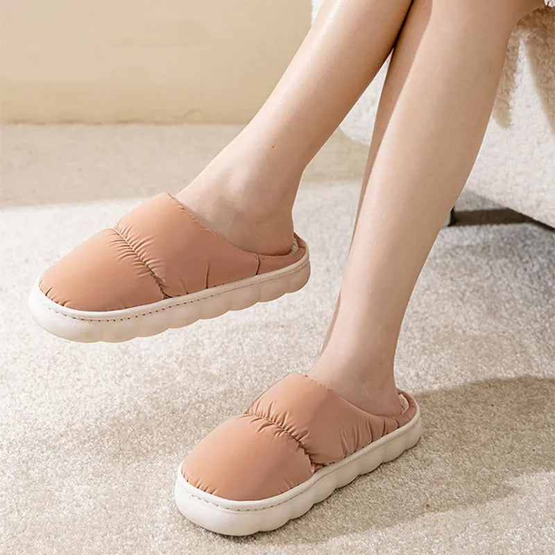 Blue thick-soled indoor slippers with artificial leather upper and plush lining on a rubber sole.