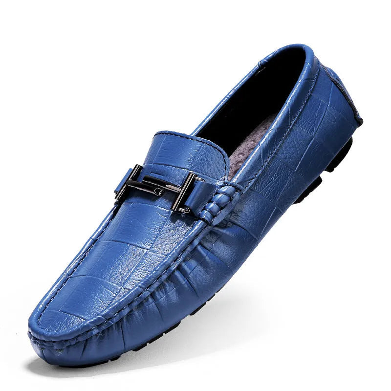 Men's black leather casual shoes with a silver belt buckle and flat rubber sole.