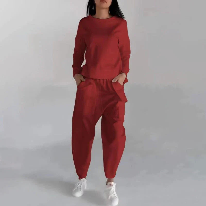 Stylish polyester sweatshirt with unique back slit design and convenient pockets for a fashionable and functional look.