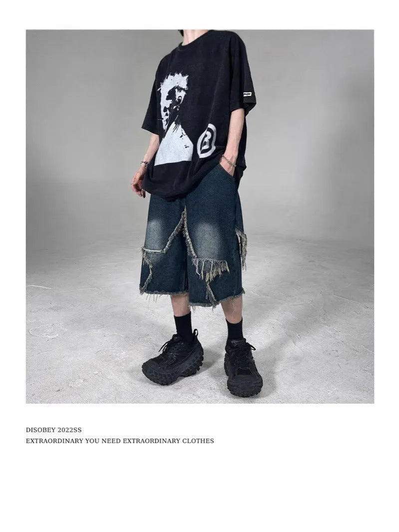 Blue denim shorts with frayed detailing and five-pointed star design in loose fit style