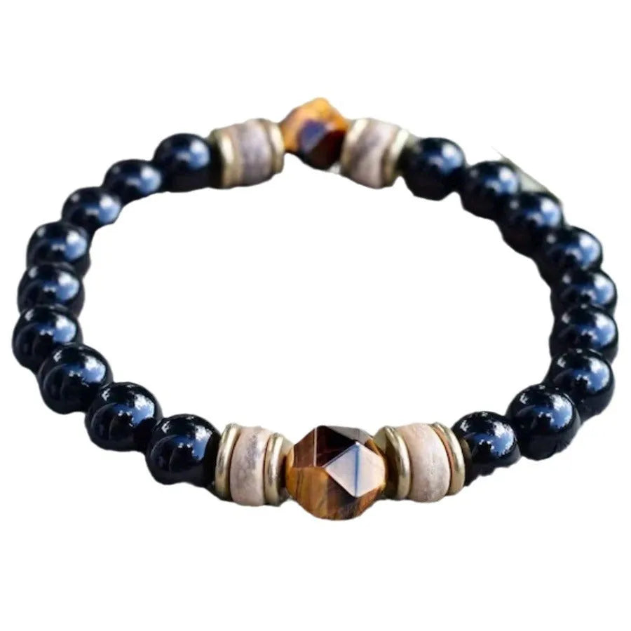 Tigereye cut obsidian bracelet with 8mm black beads on neutral background