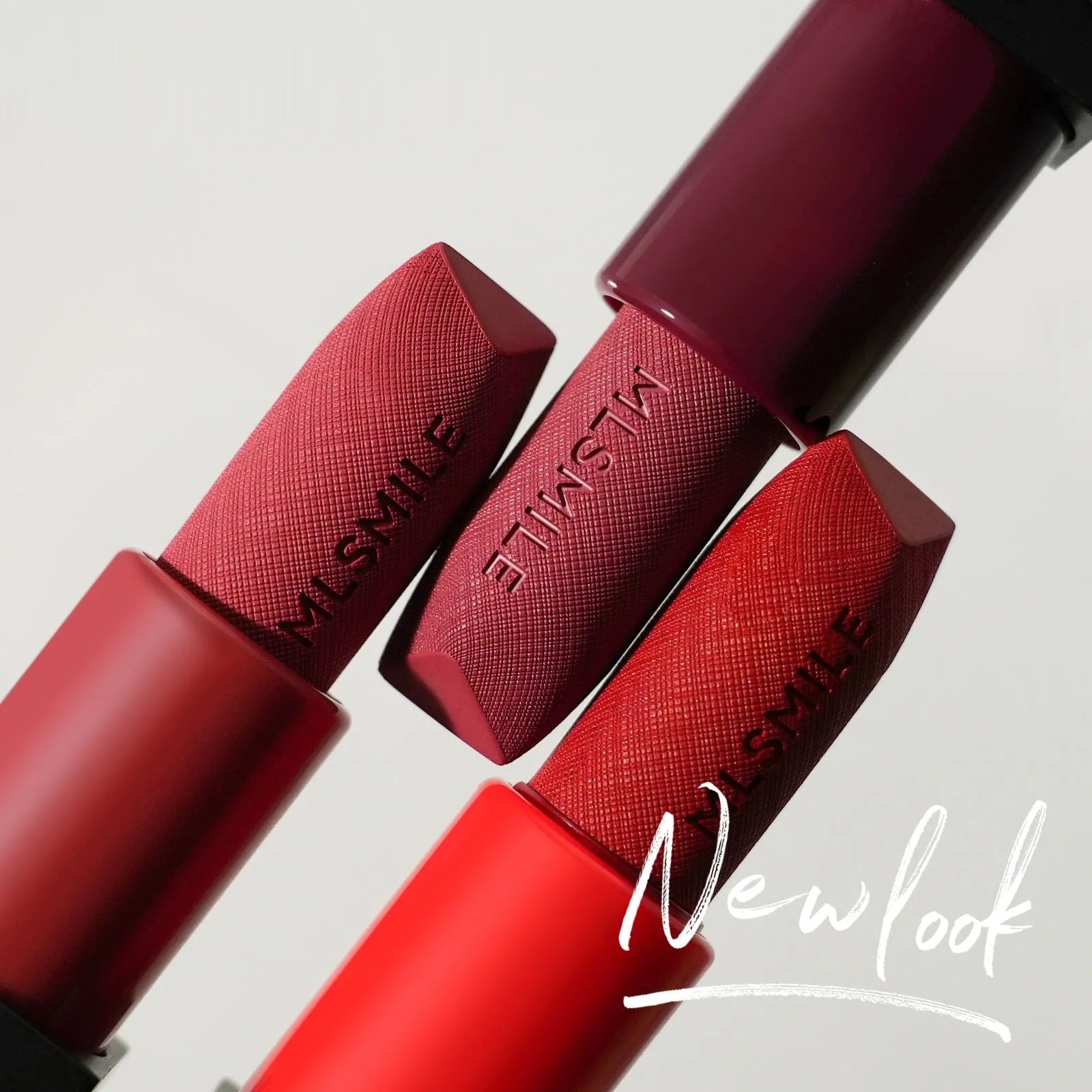 MLSMILE embossed lipstick set of three tubes in a decorative presentation box.