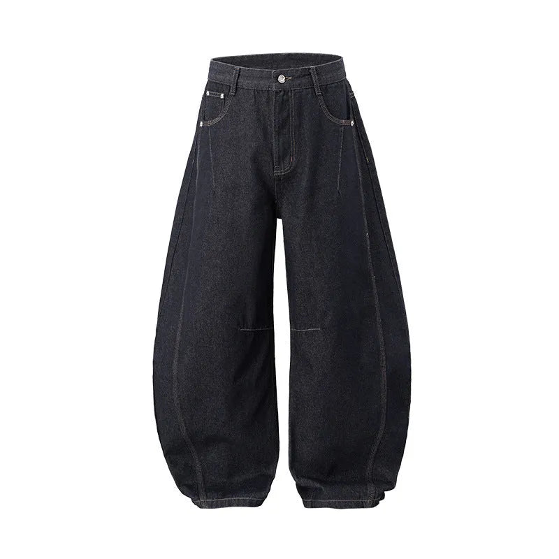Men's wide leg denim trousers in original cow colour, showing mid-waist and relaxed fit.