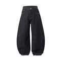 Men's wide leg denim trousers in original cow colour, showing mid-waist and relaxed fit.