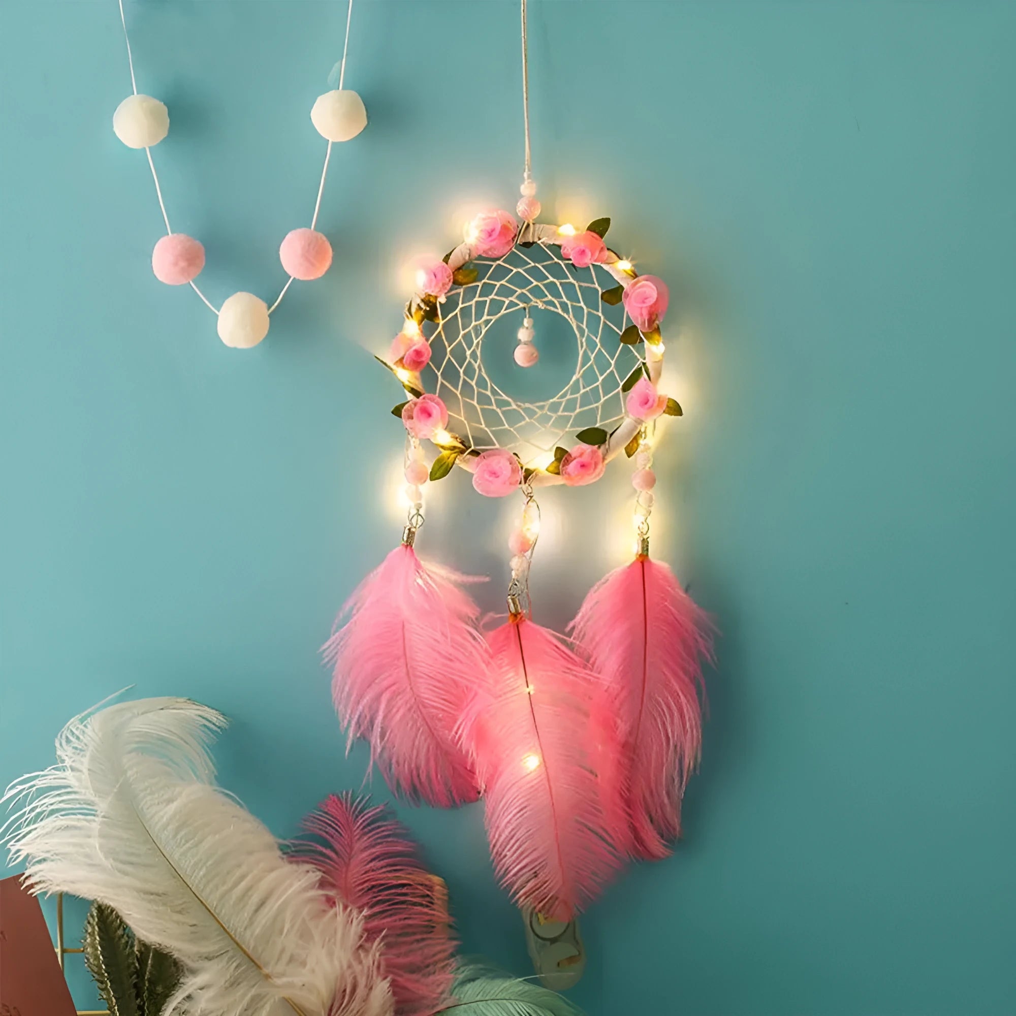 Pink ostrich feather dreamcatcher wind chime measuring 10cm for wall decoration