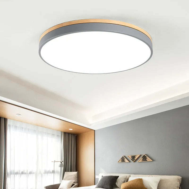 Round solid wood and acrylic LED ceiling lamp with Nordic design in white or grey.