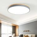 Round solid wood and acrylic LED ceiling lamp with Nordic design in white or grey.