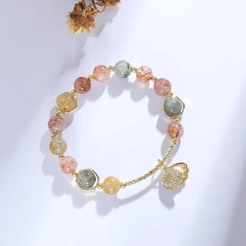 Colourful crystal shell bracelet with red sealant flower designs and animal zodiac motifs