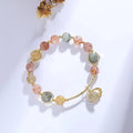 Colourful crystal shell bracelet with red sealant flower designs and animal zodiac motifs