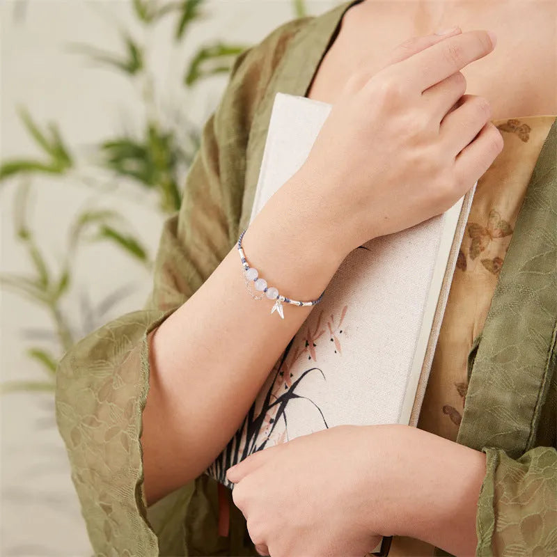 Women's Hetian Jade bracelet with diamond chalcedony and lotus charm on woven strap in light green or haze blue