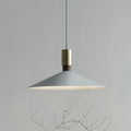 Modern round single-headed iron bar lamp in black, shown hanging over a dining table.