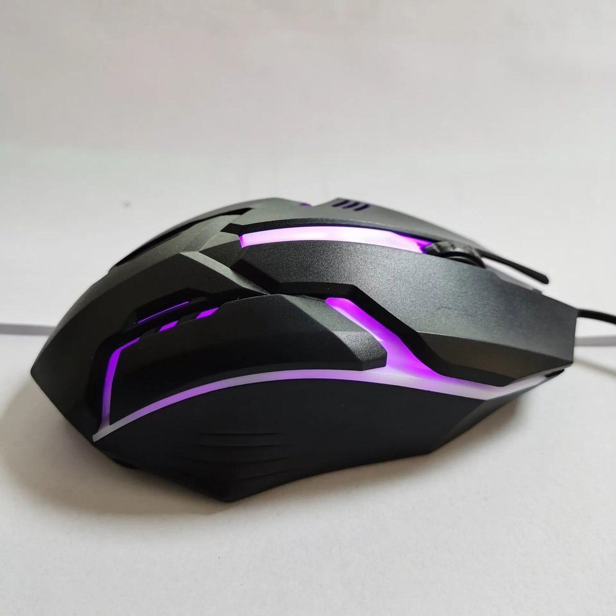 Wired USB photoelectric mouse with 1.35m cable for desktop, shown in black ribbon colour packaging or white