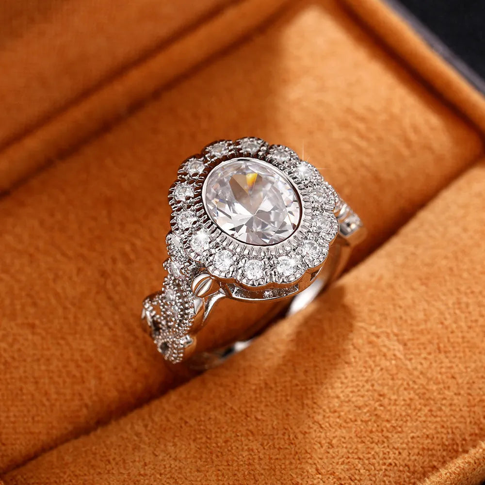 Round zircon ring with diamond copper plating in white gold colour on finger