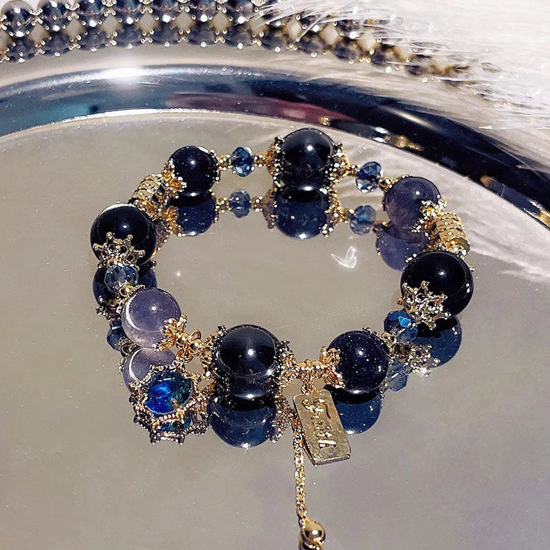Women's Galaxy colour bracelet with snowflake pendant, bow charm, and cartoon character design