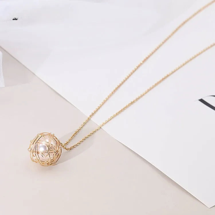 Gold minimalist pendant necklace with hollow ball and imitation pearl on twist chain 78cm