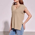 Women's camel and white V-neck sleeveless loose pullover vest with striped or plaid patterns