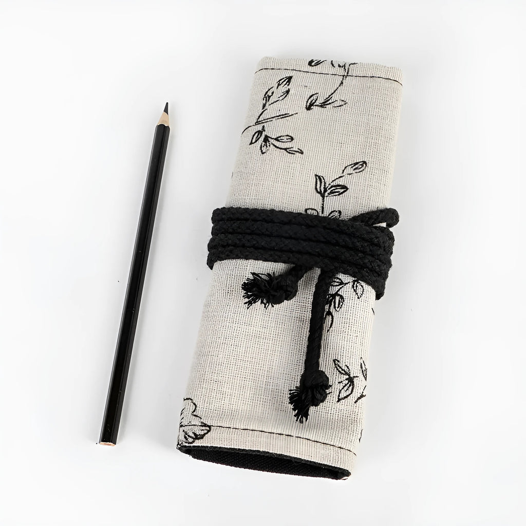 Black Peony floral print canvas pencil roll bag unrolled showing 24 or 72 holes for pencils.